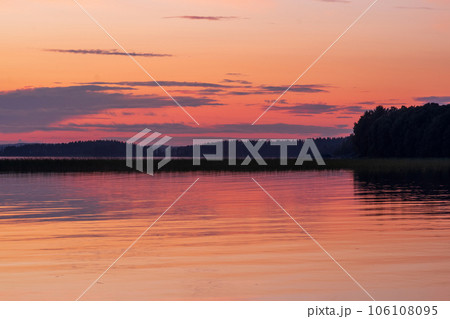natural landscape with a beautiful sunset over the wide northern lake natural landscape with a beautiful sunset over the wide northern lake 106108095