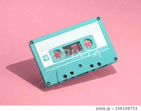 Blue vintage audio cassette on pink background. Blue vintage audio cassette on pink background. 106109753