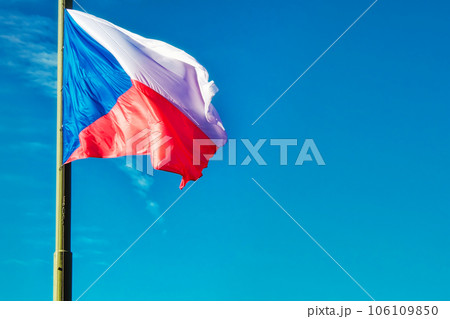 A lowered Czech flag flutters in the wind. A lowered Czech flag flutters in the wind. 106109850