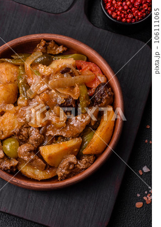 Delicious fresh stew of potatoes, tomatoes, onions, carrots and beef 106111065
