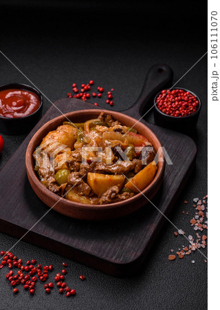 Delicious fresh stew of potatoes, tomatoes, onions, carrots and beef 106111070