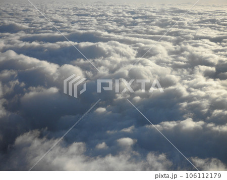 On top of fluffy curvy clouds 106112179