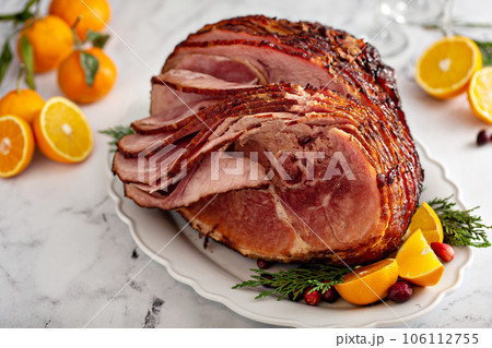 Spiral sliced Christmas ham with orange honey glaze 106112755