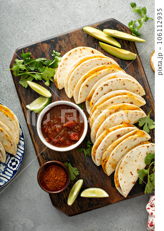 Baked tacos with pulled chicken and cheese 106112935