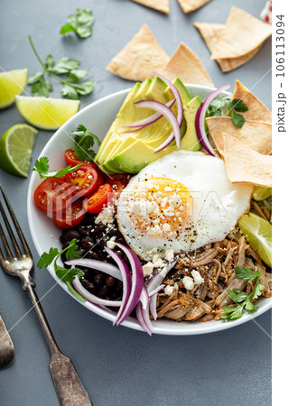 Breakfast burrito bowl with pork carnitas and rice 106113094