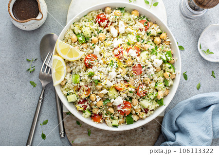 Healthy low carb salad with cauliflower rice and chickpeas 106113322
