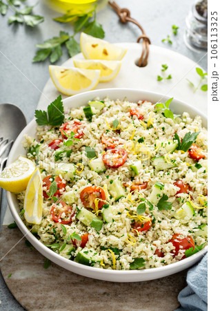 Tabbouleh salad with cauliflower rice and vegetables Tabbouleh salad with cauliflower rice and vegetables 106113325