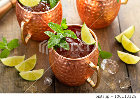Traditional Moscow Mule in classic copper mugs Traditional Moscow Mule in classic copper mugs 106113328
