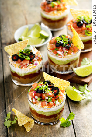 Seven layer dip in individual cups, mexican appetizer Seven layer dip in individual cups, mexican appetizer 106113415