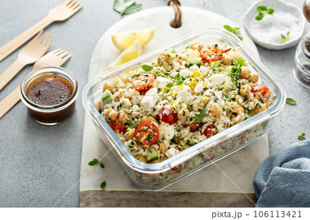 Healthy low carb salad with cauliflower rice and chickpeas 106113421