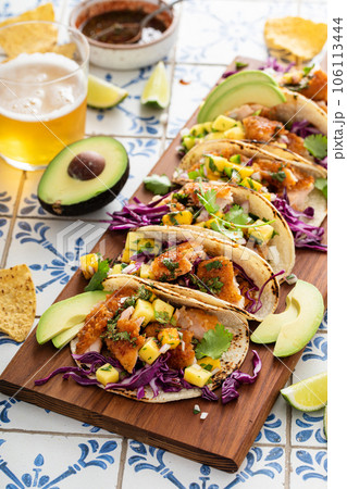 Fish tacos with mango salsa and red cabbage 106113444