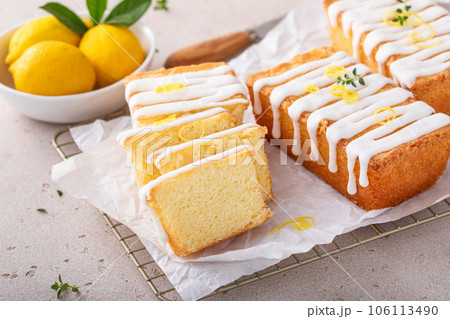Classic lemon pound cake with powdered sugar glaze dripping over Classic lemon pound cake with powdered sugar glaze dripping over 106113490