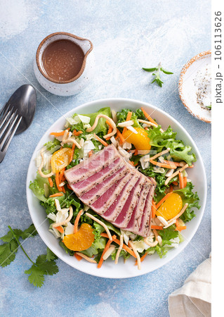 Seared tuna with asian crunchy salad with oranges Seared tuna with asian crunchy salad with oranges 106113626