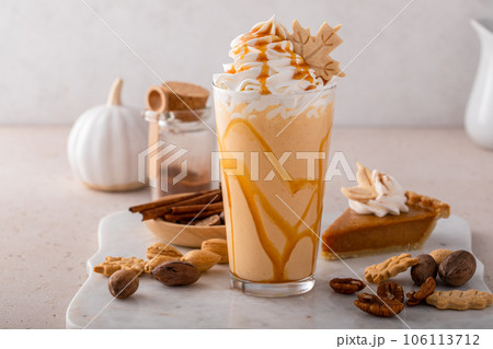 Pumpkin pie milkshake with caramel syrup and whipped cream Pumpkin pie milkshake with caramel syrup and whipped cream 106113712