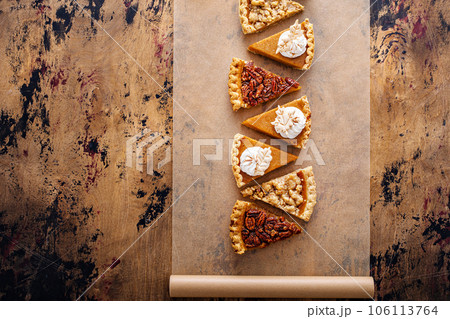 Traditional fall Thanksgiving pie slices, pumpkin and pecan pie 106113764