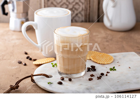 Hot coffee latte and cappuchino in a glass and mug 106114127