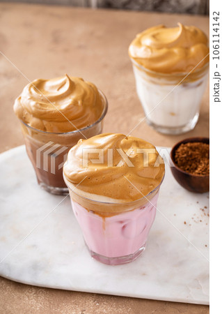 Variety of dalgona whipped coffee drinks with chocolate and strawberry milk 106114142