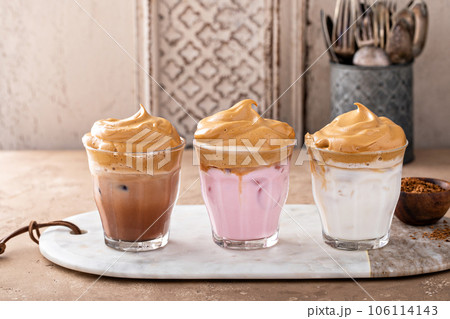 Variety of dalgona whipped coffee drinks with chocolate and strawberry milk Variety of dalgona whipped coffee drinks with chocolate and strawberry milk 106114143