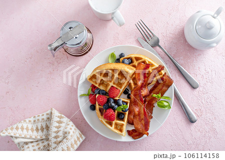 Belgian waffles with bacon and fresh berries for breakfast 106114158