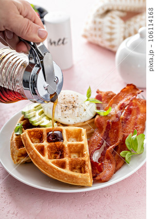 Crispy Belgian waffles with avocado and bacon for breakfast 106114168
