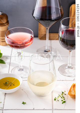 Variety of wine glasses with red, white and rose wine Variety of wine glasses with red, white and rose wine 106114194