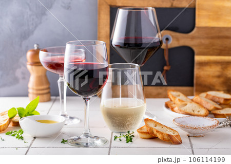 Variety of wine glasses with red, white and rose wine Variety of wine glasses with red, white and rose wine 106114199