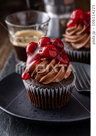 Black forest cupcake with whipped ganache and cherry topping Black forest cupcake with whipped ganache and cherry topping 106114225