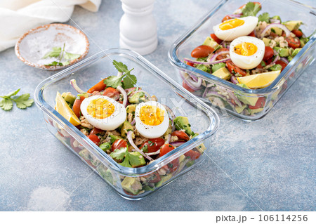 Meal prep containers with avocado tuna salad and boiled egg Meal prep containers with avocado tuna salad and boiled egg 106114256