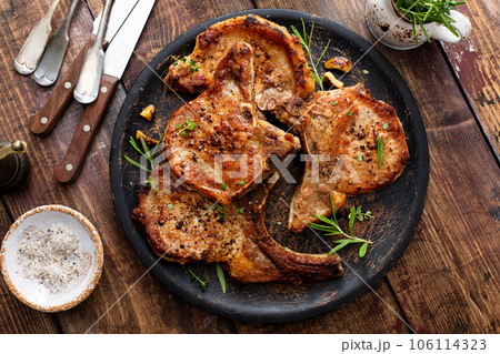 Grilled or pan fried pork chops on the bone Grilled or pan fried pork chops on the bone 106114323