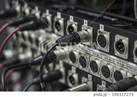 XLR jack cable connected at rear end of equipment,shallow depth 106117275