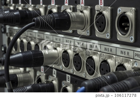 XLR jack cable connected at rear end of equipment 106117278