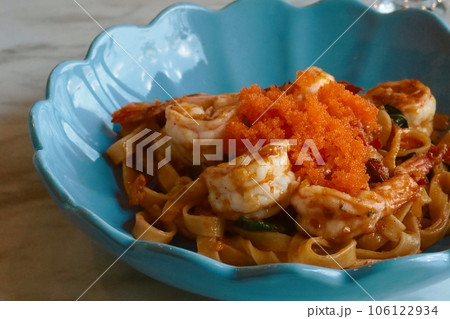 closeup spicy fried shrimp pasta on top with mentaiko 106122934