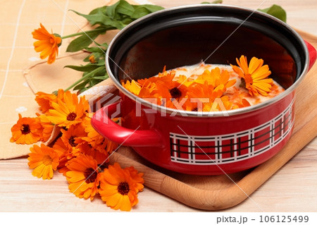 Making organic calendula cream for healthy skin 106125499
