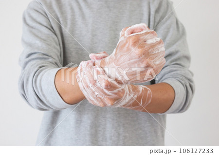 Man wash hands with soap for COVID-19 corona virus prevention concept Man wash hands with soap for COVID-19 corona virus prevention concept 106127233