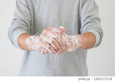 Man wash hands with soap for COVID-19 corona virus prevention concept Man wash hands with soap for COVID-19 corona virus prevention concept 106127234