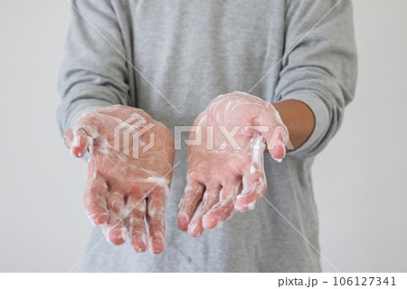 Man wash hands with soap for COVID-19 corona virus prevention concept Man wash hands with soap for COVID-19 corona virus prevention concept 106127341