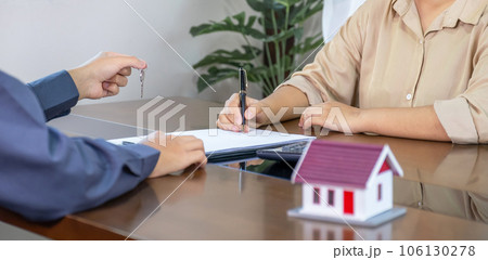 Real estate agents and buyers discuss signing a business contract, renting, buying, mortgage, loan or home insurance 106130278