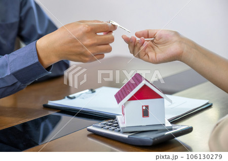 Real estate agents and buyers discuss signing a business contract, renting, buying, mortgage, loan or home insurance Real estate agents and buyers discuss signing a business contract, renting, buying, mortgage, loan or home insurance 106130279