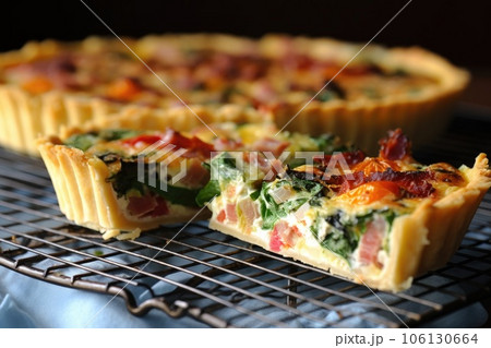 sliced quiche cooling on a wire rack sliced quiche cooling on a wire rack 106130664