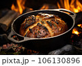 cast iron dutch oven with artisanal bread inside 106130896