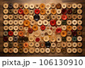 thread spools and buttons arranged in a creative pattern 106130910