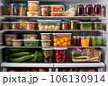 clean refrigerator with organized storage containers inside 106130914