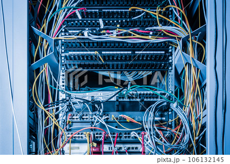 Detail of server with patch cables plugged in ethernet ports 106132145