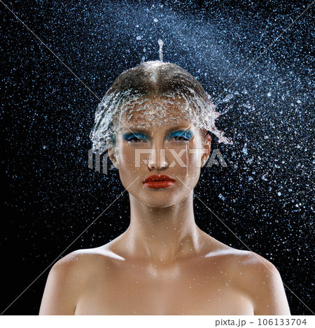 Attractive young girl with bright and colorful makeup on face and stream of water isolated dark mode background. Scin care concept. 106133704