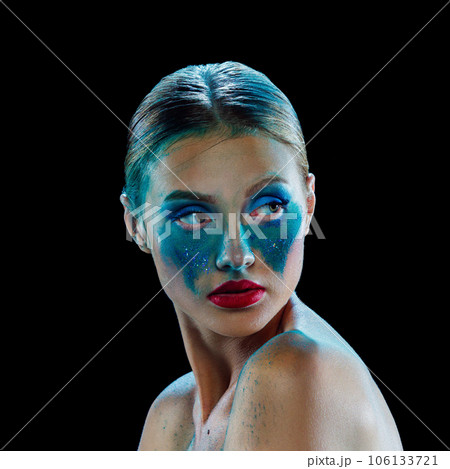 Young beautiful woman with smeared bright makeup and bare shoulders. She is upset and looking away. Extraordinary look Young beautiful woman with smeared bright makeup and bare shoulders. She is upset and looking away. Extraordinary look 106133721