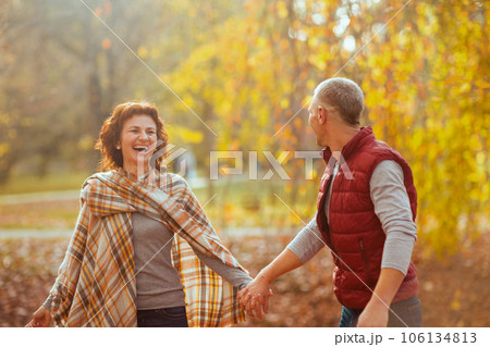 happy stylish boyfriend and girlfriend in park walking happy stylish boyfriend and girlfriend in park walking 106134813