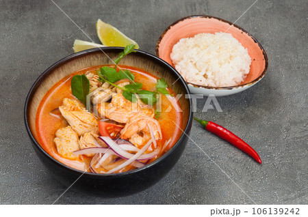 popular spicy Thai tom yam soup with chicken and shrimp. served with rice popular spicy Thai tom yam soup with chicken and shrimp. served with rice 106139242