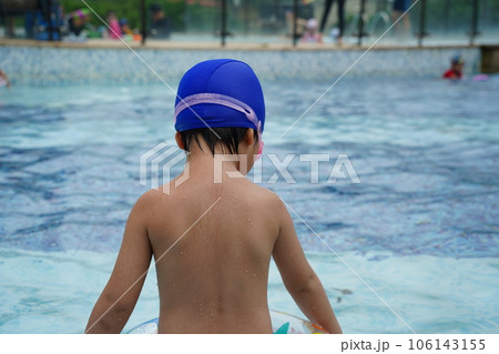 A kid swim in the pool. A kid swim in the pool. 106143155