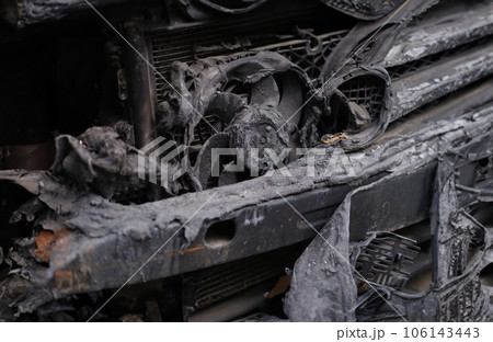 Burnt engine compartment of modern car closeup Burnt engine compartment of modern car closeup 106143443