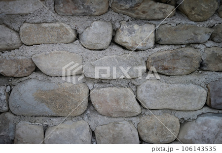 Neatly stacked rough cut stone wall seamless texture background Neatly stacked rough cut stone wall seamless texture background 106143535
